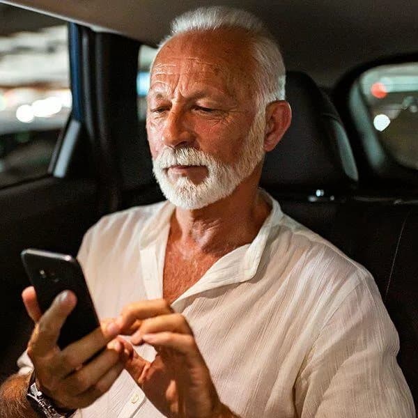 A business owner checking their local business listings on their mobile phone