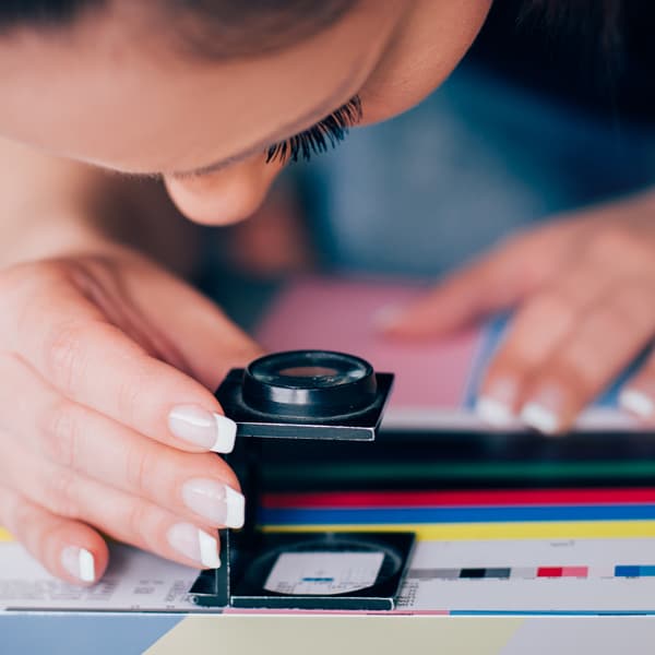 A designer checking the measurements of her design before printing