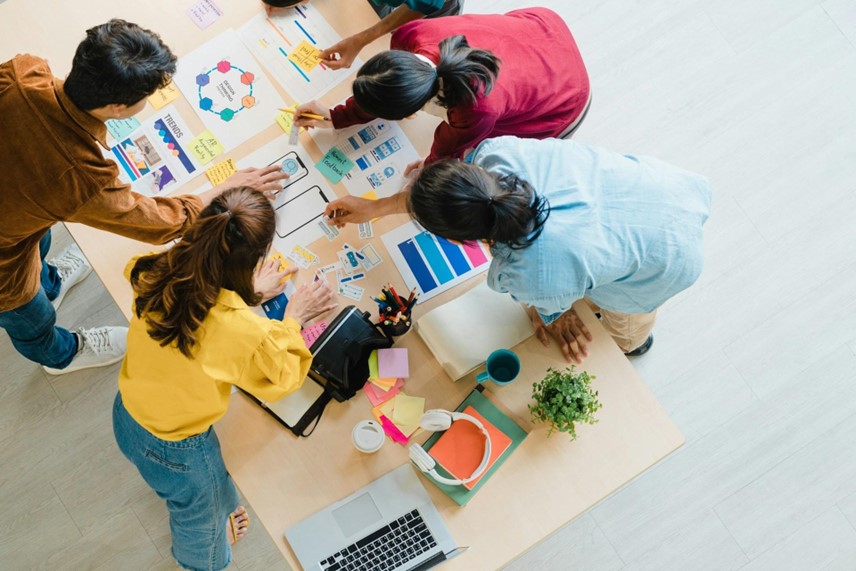 A top down view of a marketing team working out how to create a lead magnet